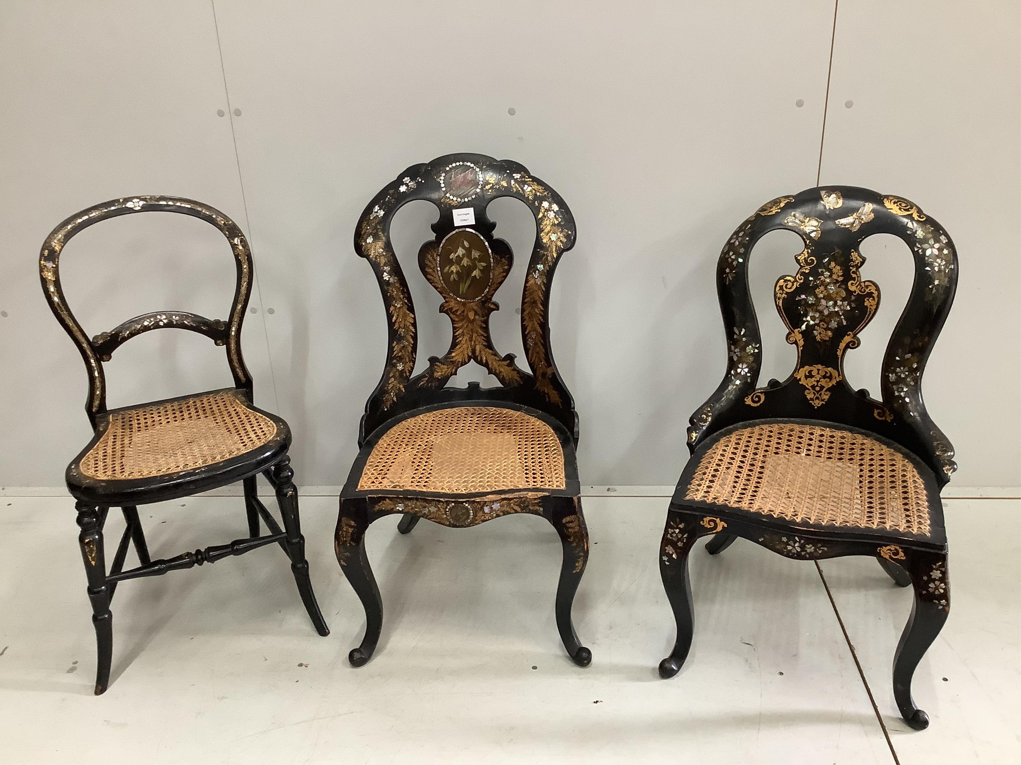 Three Victorian painted mother of pearl inlaid papier mache cane seat side chairs, largest width 42cm, height 84cm. Condition - fair